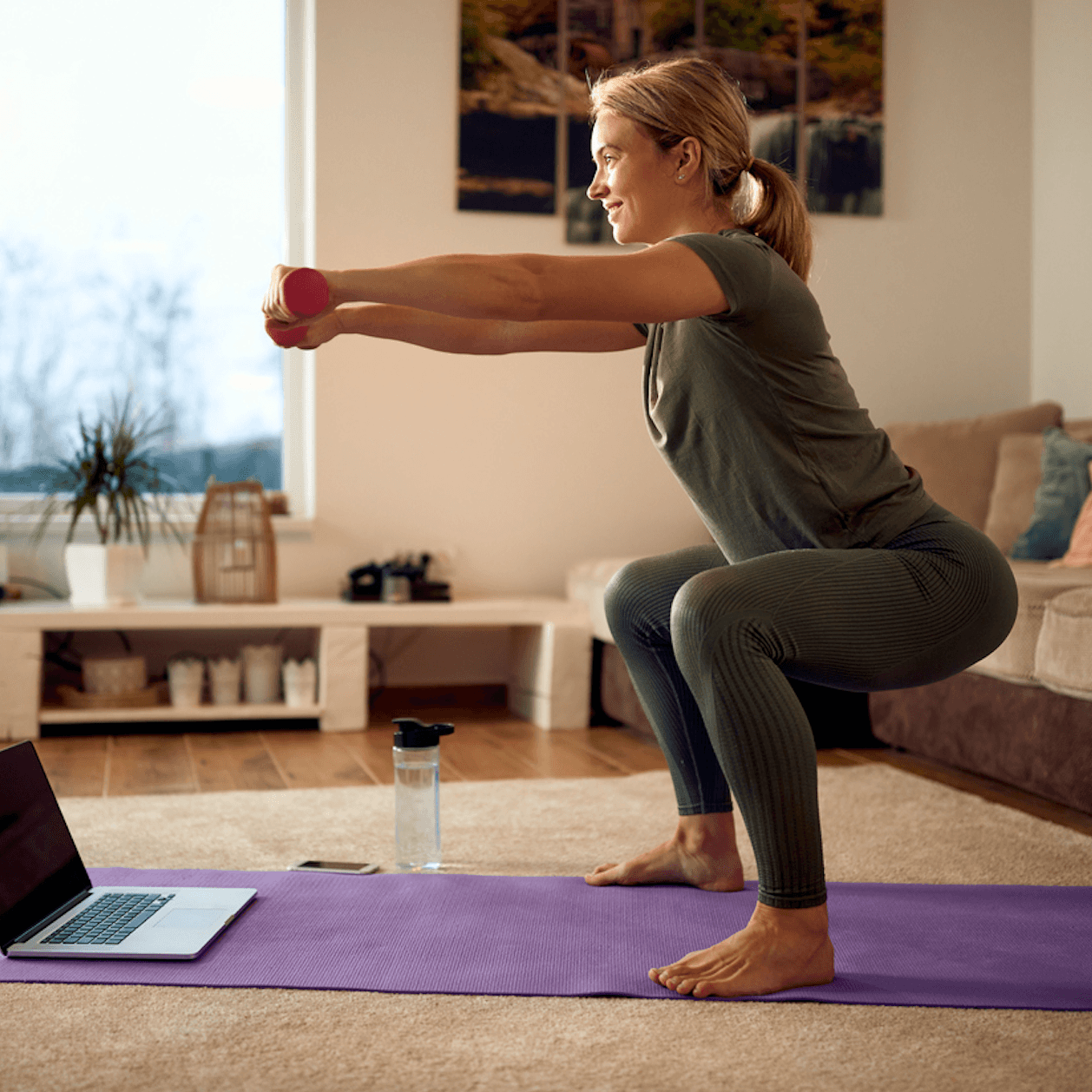 Image of a woman squatting .