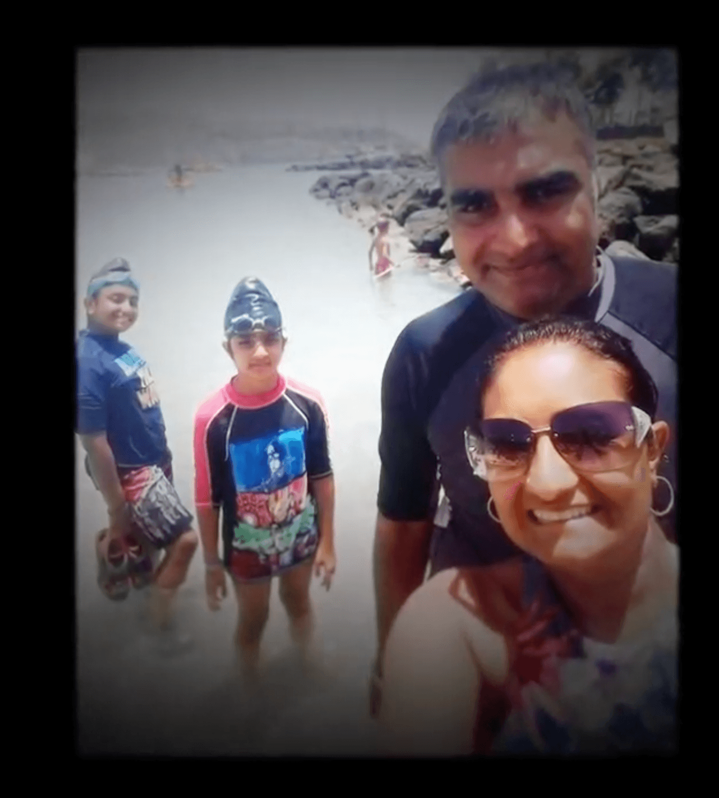 Selfie of Sal and her family on the beach.