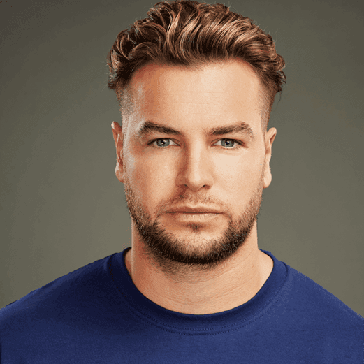 Headshot of Chris Hughes in a stand up to cancer t shirt.