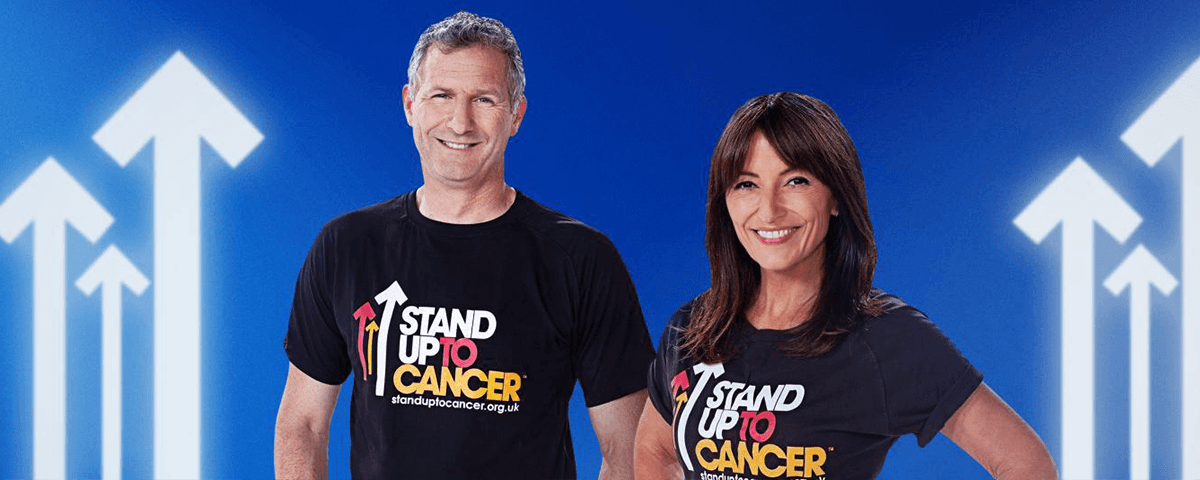 Image of Davina McCall and Adam Hills in SU2C t-shirts.